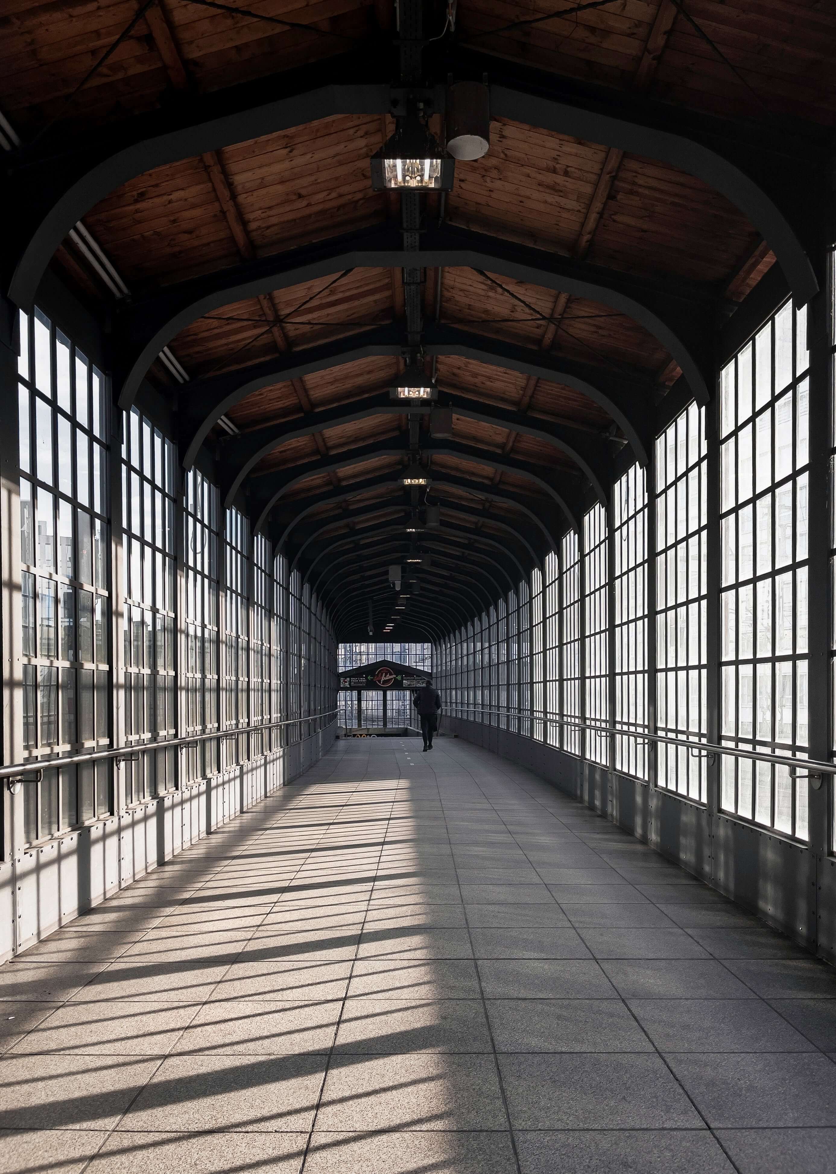 a picture of a tunnel full of windows and morning light